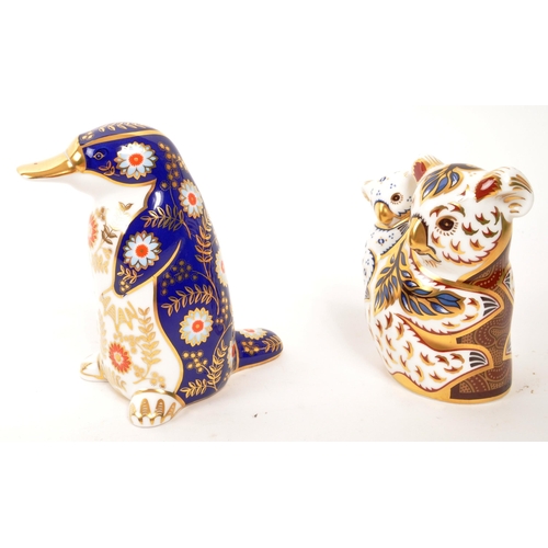 90 - Royal Crown Derby - Two porcelain china Royal Crown Derby paperweight animal figures. Comprising of ... 