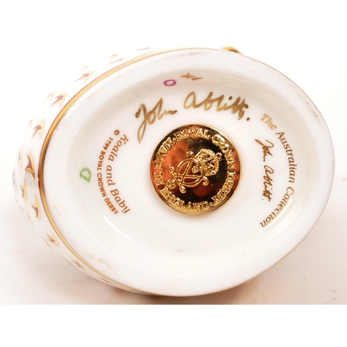 90 - Royal Crown Derby - Two porcelain china Royal Crown Derby paperweight animal figures. Comprising of ... 