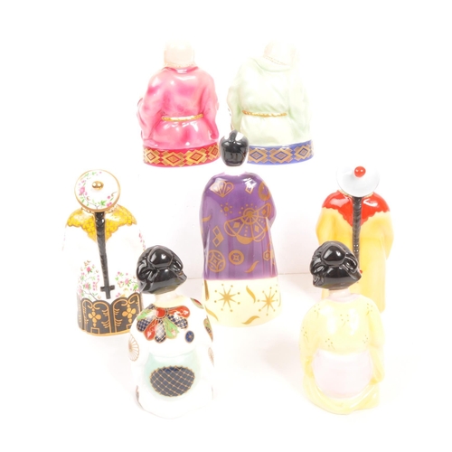 95 - Royal Worcester - A collection of seven porcelain china Royal Worcester candle snuffers. Comprising ... 