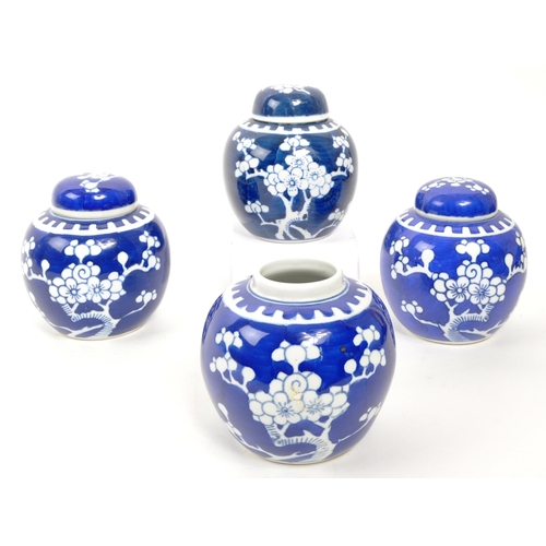 99 - A collection of four late 20th Century Chinese ceramic ginger jars having prunus design in blue and ... 