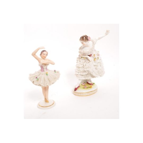 115 - Volkstedt - An early 20th Century German porcelain china Volkstedt crinoline figurine in the form of... 