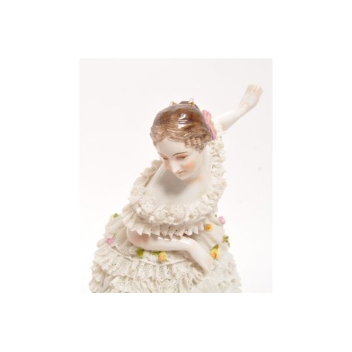 115 - Volkstedt - An early 20th Century German porcelain china Volkstedt crinoline figurine in the form of... 