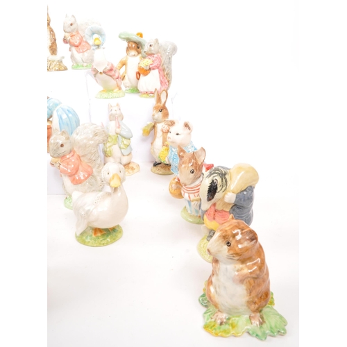 11 - Beatrix Potter - Beswick - A large collection of mid century and later Beswick Peter Rabbit porcelai... 