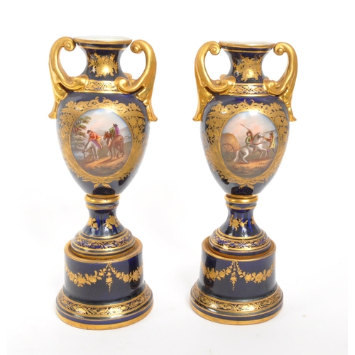 110 - Dresden - A pair of late 19th Century Dresden porcelain twin handled vases having cobalt ground with... 