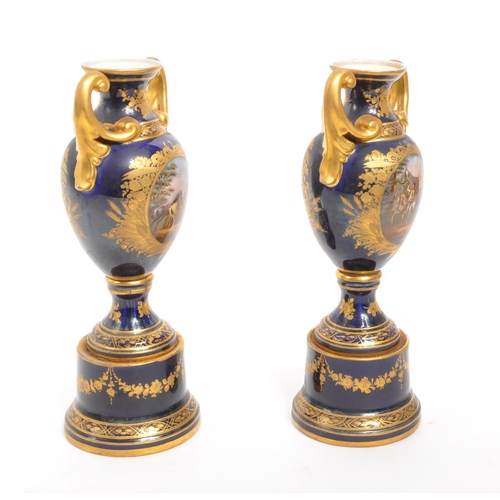 110 - Dresden - A pair of late 19th Century Dresden porcelain twin handled vases having cobalt ground with... 