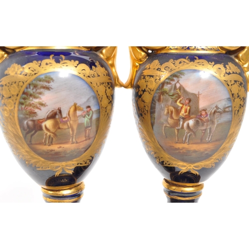 110 - Dresden - A pair of late 19th Century Dresden porcelain twin handled vases having cobalt ground with... 