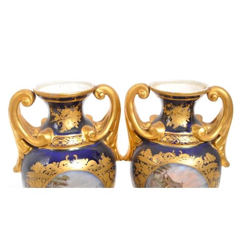 110 - Dresden - A pair of late 19th Century Dresden porcelain twin handled vases having cobalt ground with... 