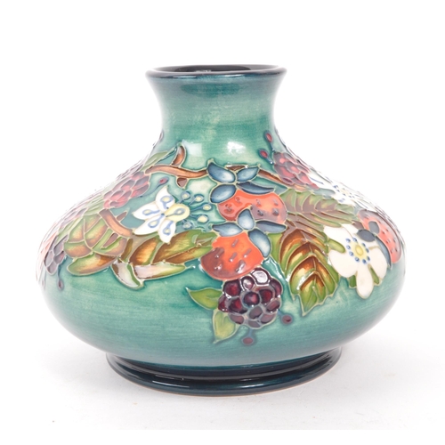 111 - Moorcroft Pottery - A centenary Year vase in the carousel design, with impressed and painted marks t... 