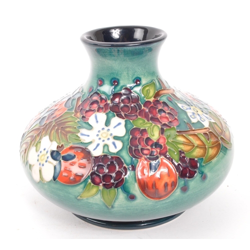 111 - Moorcroft Pottery - A centenary Year vase in the carousel design, with impressed and painted marks t... 