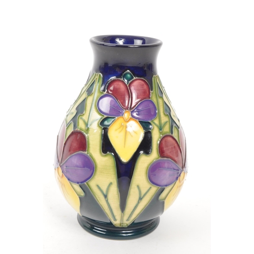 117 - Moorcroft Pottery - A late 20th century 1994 heartsease pattern ceramic vase. Signed J Moorcroft and... 