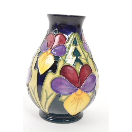 117 - Moorcroft Pottery - A late 20th century 1994 heartsease pattern ceramic vase. Signed J Moorcroft and... 