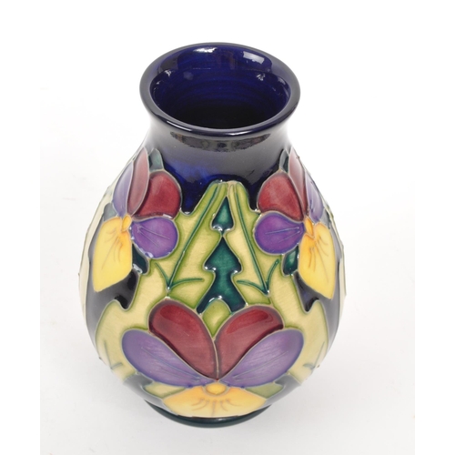 117 - Moorcroft Pottery - A late 20th century 1994 heartsease pattern ceramic vase. Signed J Moorcroft and... 