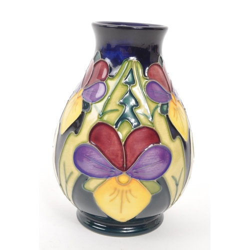 117 - Moorcroft Pottery - A late 20th century 1994 heartsease pattern ceramic vase. Signed J Moorcroft and... 