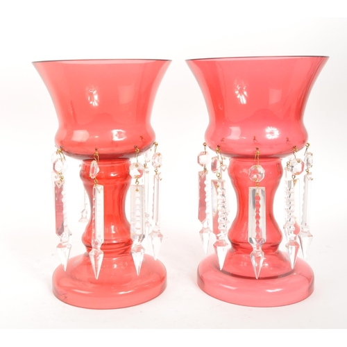 12 - Pair of mid 20th century circa 1960s cranberry glass lustre vases. Circular form with shaped column,... 