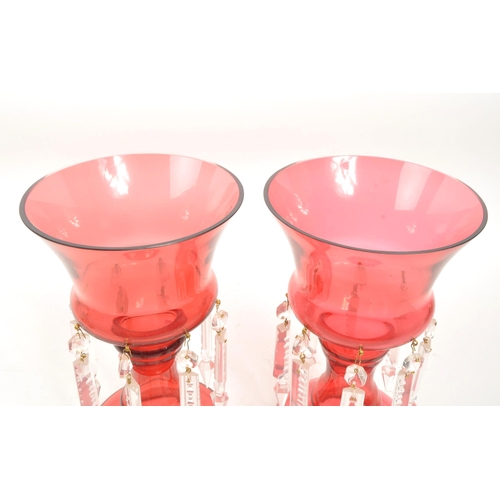 12 - Pair of mid 20th century circa 1960s cranberry glass lustre vases. Circular form with shaped column,... 