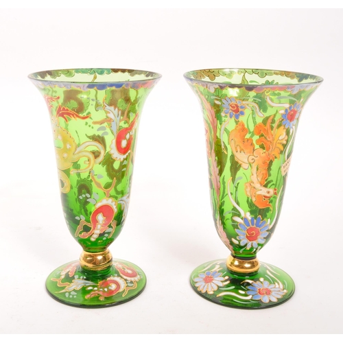 130 - A pair of bohemian 20th Century vintage green glass and enamel vases each having floral animal desig... 