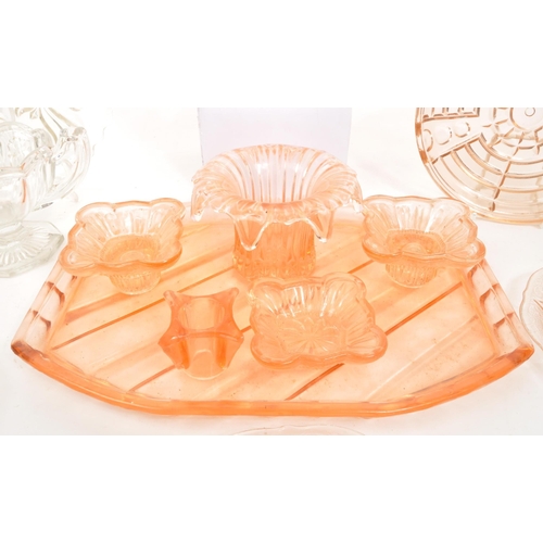 133 - A collection of 20th Century circa 1930s / 40s Art Deco peach pink glass items comprising of large c... 