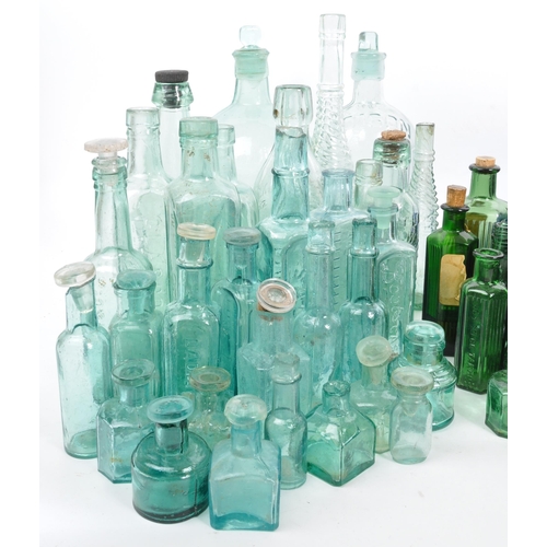 134 - A large collection of early 20th Century and later coloured glass bottles to include medicinal and p... 