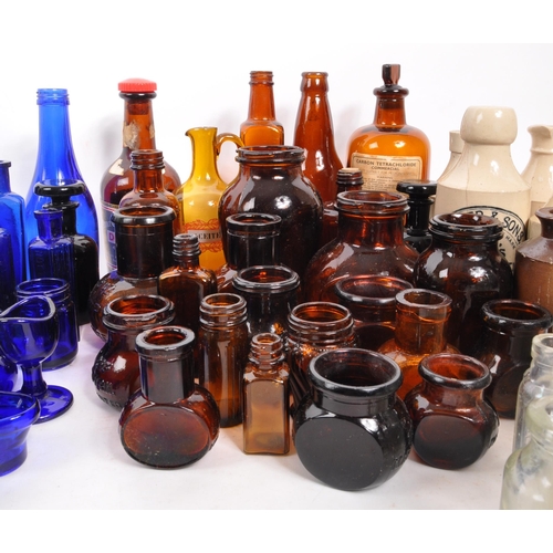 134 - A large collection of early 20th Century and later coloured glass bottles to include medicinal and p... 