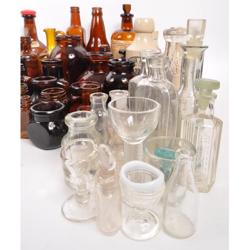 134 - A large collection of early 20th Century and later coloured glass bottles to include medicinal and p... 