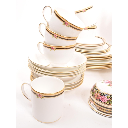 135 - Wedgwood - A porcelain bone china Wedgwood dinner and tea service in the Clio pattern. Comprising of... 