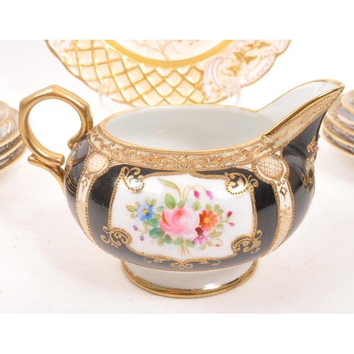 139 - Noritake - A set of porcelain china Noritake jewelled gilt items comprising of two teacups and sauce... 