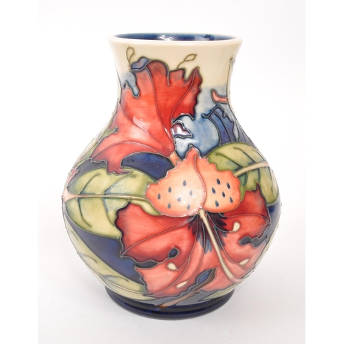 150 - Moorcroft - A china Moorcroft Pottery vase in the ' Simeon ' pattern designed by Philip Gibson and i... 