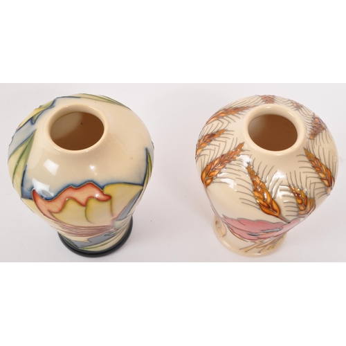 157 - Moorcroft Pottery - Two contemporary ceramic vases - Comprising of harvest poppy shape 576/4 togethe... 