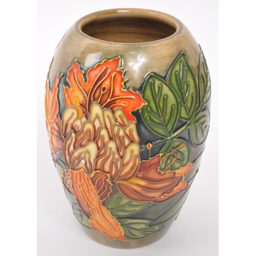 160 - Moorcroft Pottery - A contemporary Flame of the forest ceramic gloss vase. Stamped to underside with... 