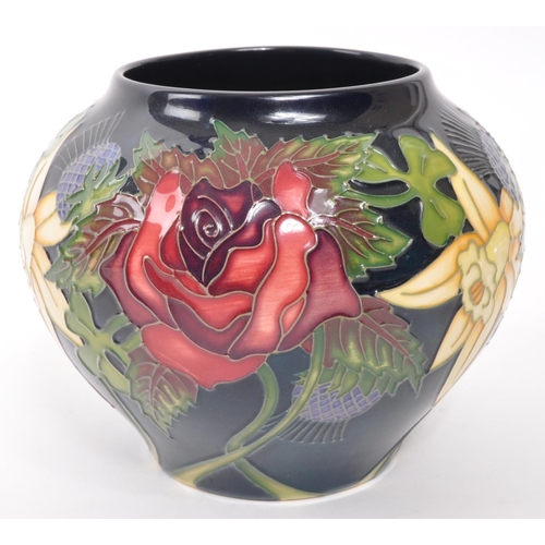 161 - Moorcroft Pottery - A contemporary ceramic vase of squat form decorated in the Diamond Jubilee patte... 