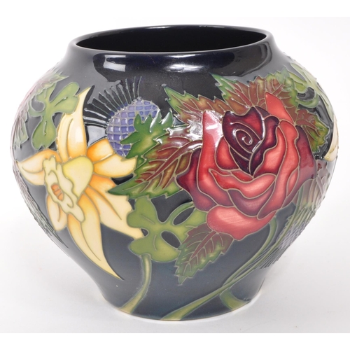 161 - Moorcroft Pottery - A contemporary ceramic vase of squat form decorated in the Diamond Jubilee patte... 