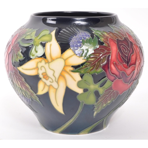 161 - Moorcroft Pottery - A contemporary ceramic vase of squat form decorated in the Diamond Jubilee patte... 