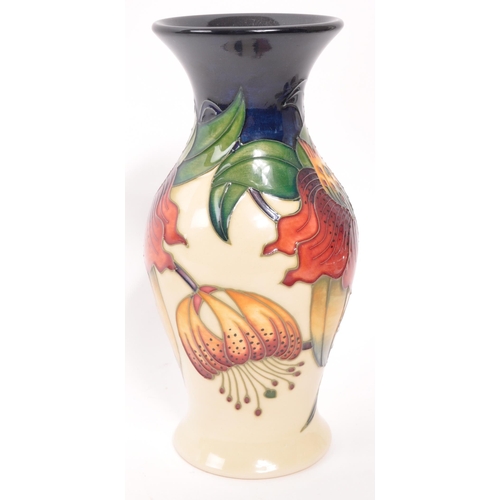 165 - Moorcroft - A late 20th century ceramic vase. Anna Lily Design with makers stamps and initials to un... 