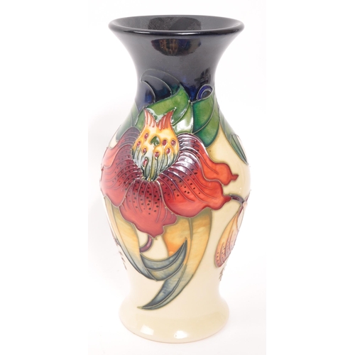 165 - Moorcroft - A late 20th century ceramic vase. Anna Lily Design with makers stamps and initials to un... 