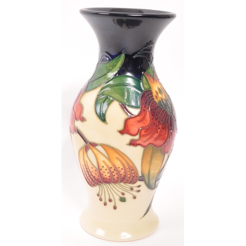 165 - Moorcroft - A late 20th century ceramic vase. Anna Lily Design with makers stamps and initials to un... 