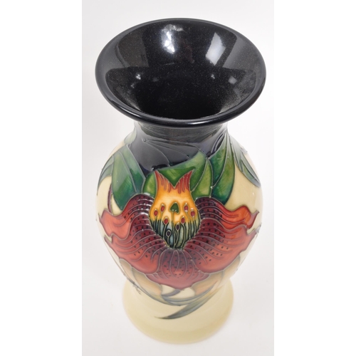 165 - Moorcroft - A late 20th century ceramic vase. Anna Lily Design with makers stamps and initials to un... 