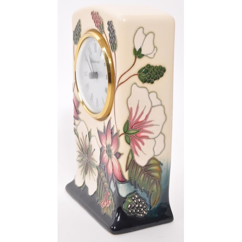 166 - Moorcroft Pottery - A contemporary ceramic mantel clock. Bramble Revisited design with white face, e... 