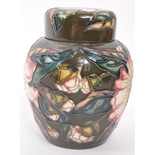 168 - Moorcroft Pottery - A late 20th century Moorcroft Gustavia Augusta pattern ginger jar and cover desi... 