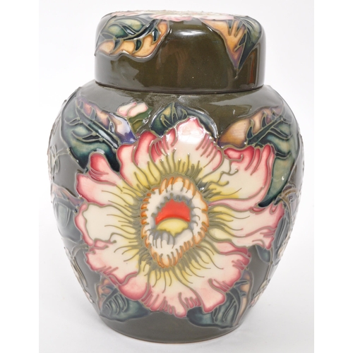 168 - Moorcroft Pottery - A late 20th century Moorcroft Gustavia Augusta pattern ginger jar and cover desi... 