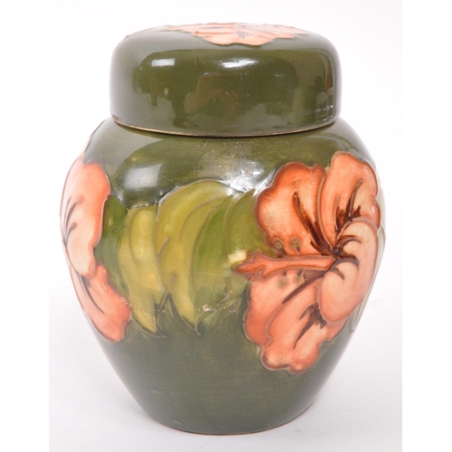 170 - Moorcroft Pottery - A late 20th century ginger jar in Hibiscus pattern on green ground, with maker m... 