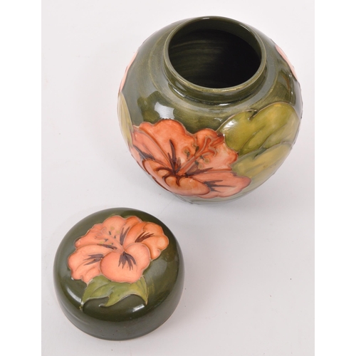 170 - Moorcroft Pottery - A late 20th century ginger jar in Hibiscus pattern on green ground, with maker m... 