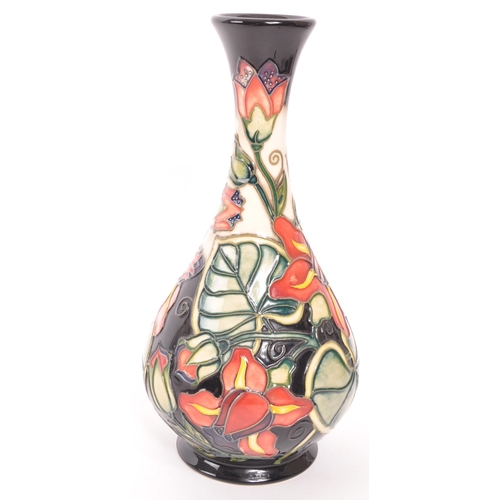 177 - Moorcroft Pottery - Palmata - Designed by Shirley Hayes tube lined floral design bud / stem vase in ... 