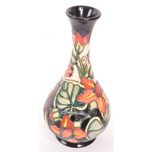 177 - Moorcroft Pottery - Palmata - Designed by Shirley Hayes tube lined floral design bud / stem vase in ... 