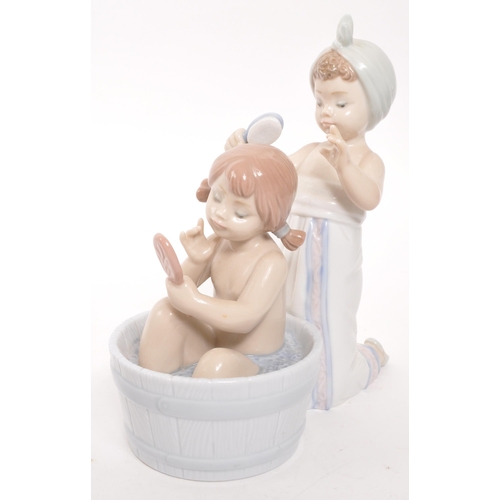 193 - Lladro - Two 20th century Spanish porcelain figurines to include Bathing Beauties 6457 and Bath Time... 