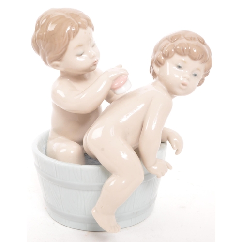 193 - Lladro - Two 20th century Spanish porcelain figurines to include Bathing Beauties 6457 and Bath Time... 