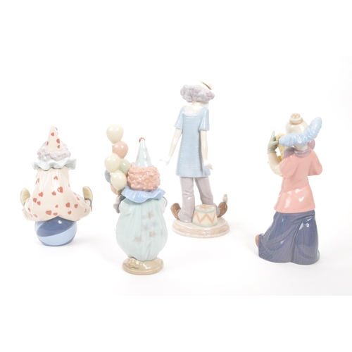 194 - Lladro & Nao - A collection of four vintage 20th century Spanish porcelain clown figurines to in... 