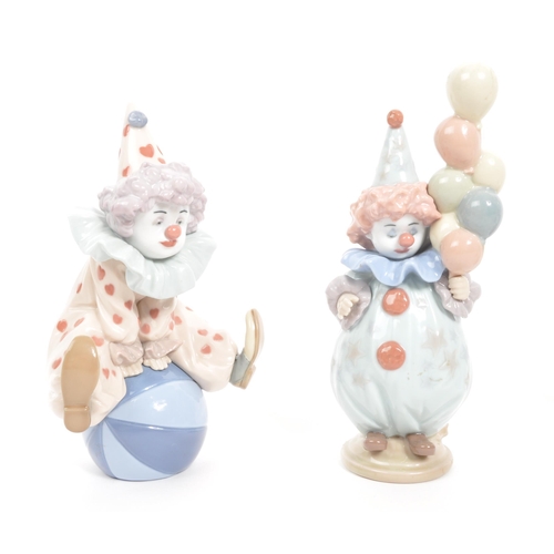 194 - Lladro & Nao - A collection of four vintage 20th century Spanish porcelain clown figurines to in... 