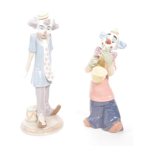 194 - Lladro & Nao - A collection of four vintage 20th century Spanish porcelain clown figurines to in... 