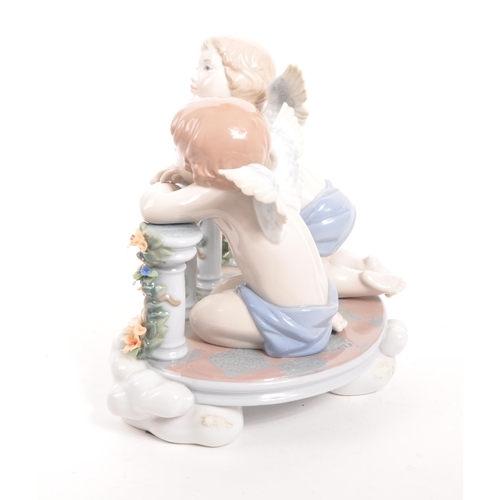 2 - Lladro - A contemporary 2012 celestial / cherub balcony figure. Spanish gloss porcelain construction... 