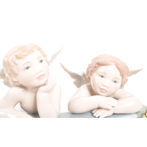 2 - Lladro - A contemporary 2012 celestial / cherub balcony figure. Spanish gloss porcelain construction... 